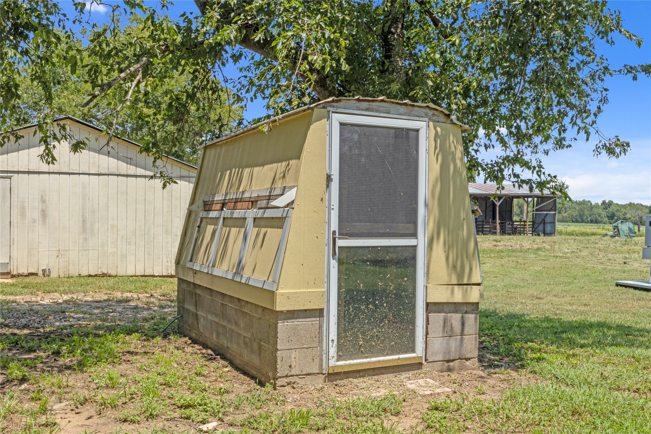 451 Pleasant Grove Road Elgin, TX 78621 - Photo 24 of 32 a front view of a house with a yard