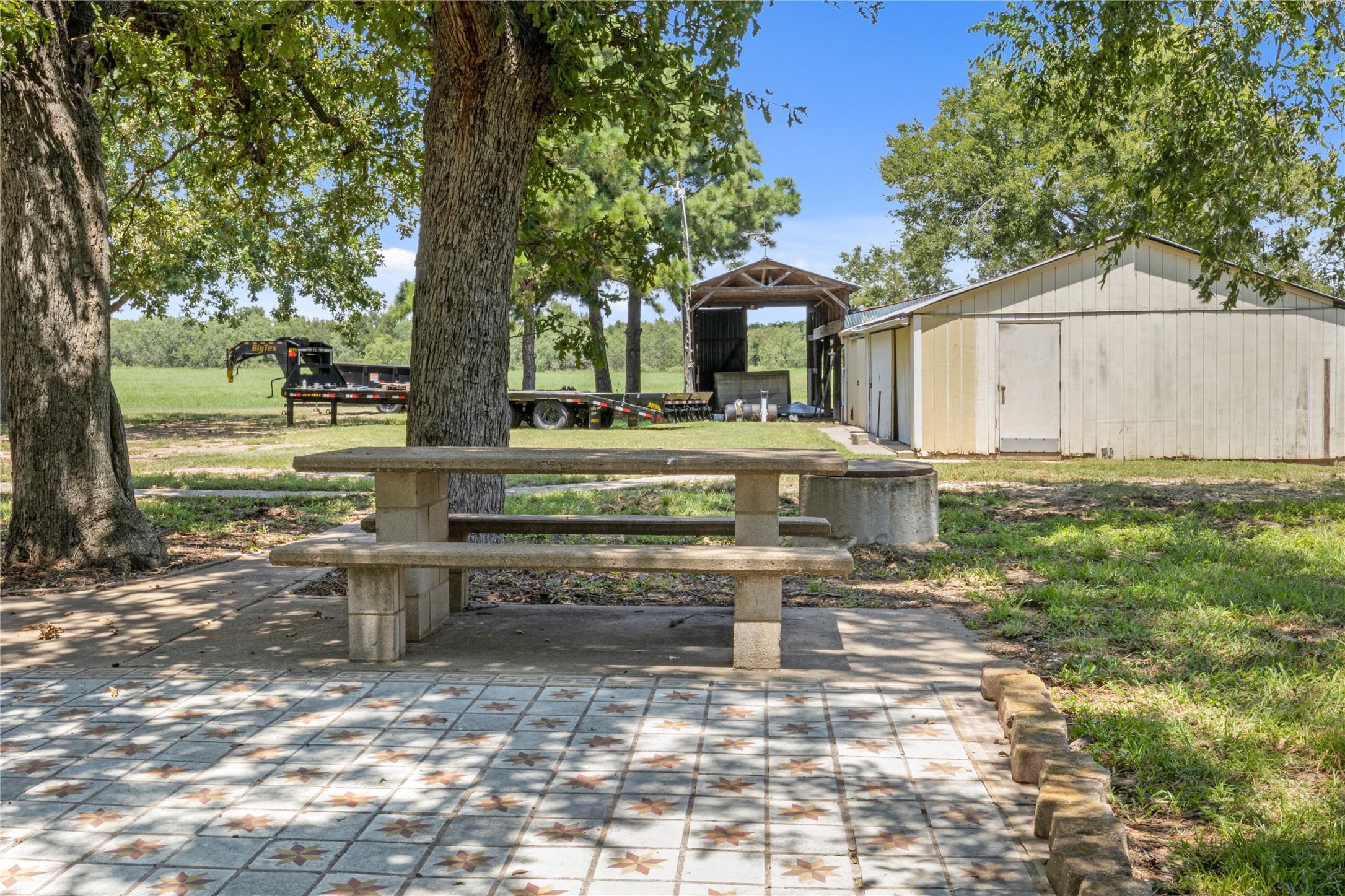 451 Pleasant Grove Road Elgin, TX 78621 - Photo 25 of 32 a view of a house with backyard and sitting area