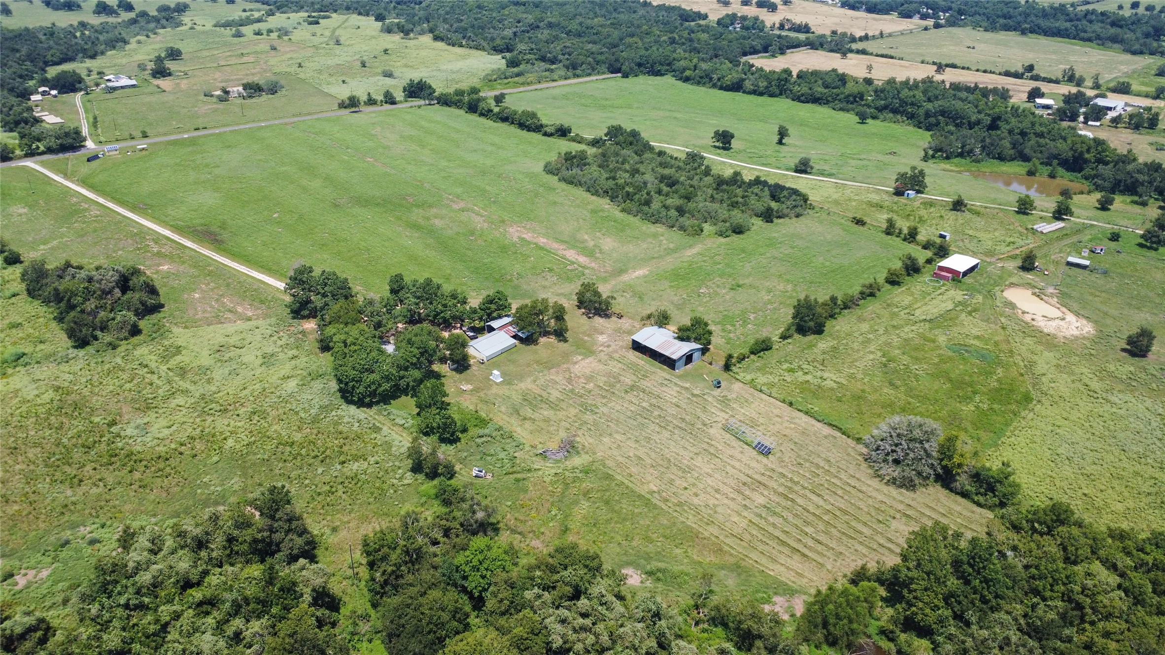 451 Pleasant Grove Road Elgin, TX 78621 - Photo 30 of 32 an aerial view of a residential houses with outdoor space