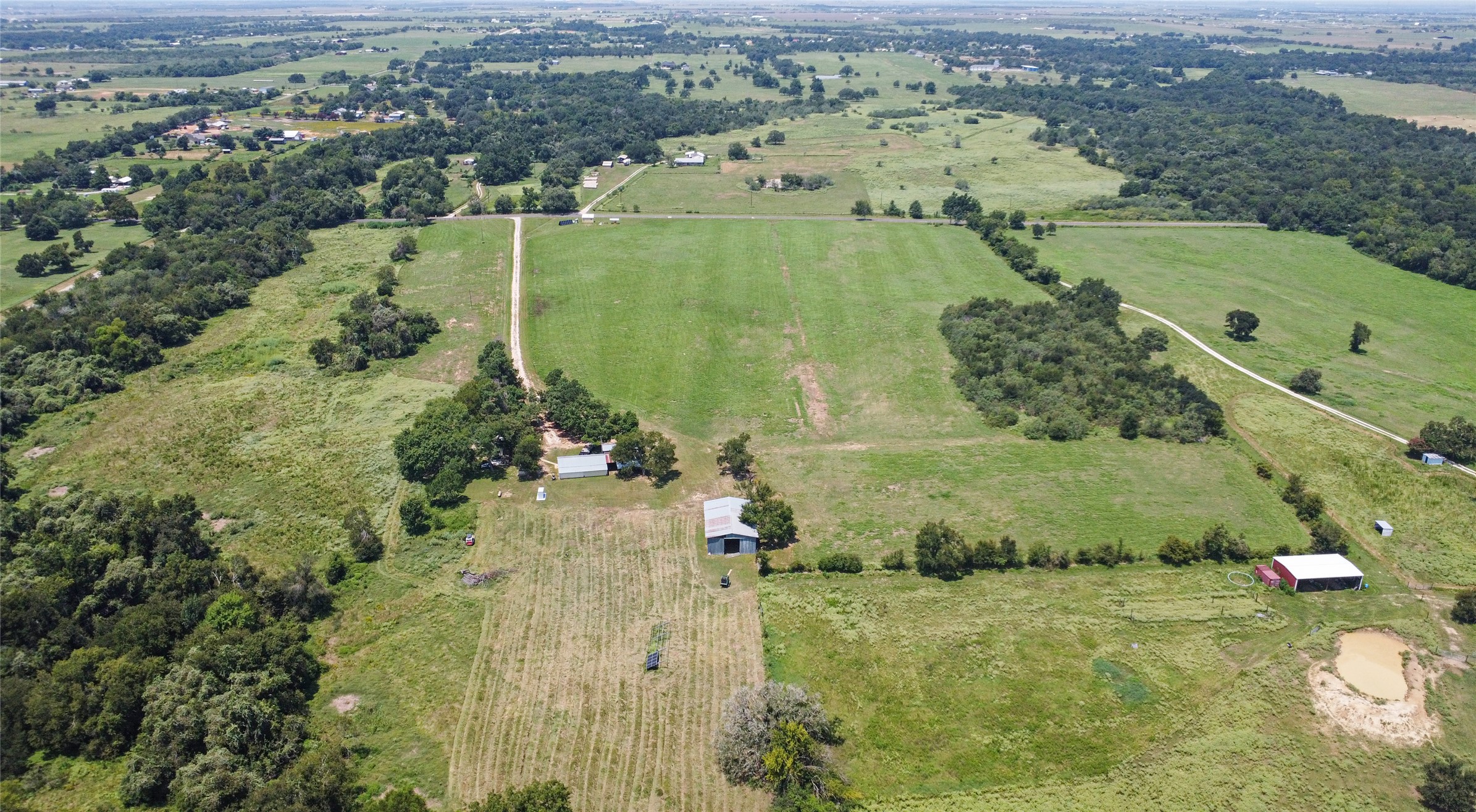 451 Pleasant Grove Road Elgin, TX 78621 - Photo 31 of 32 an aerial view of a houses with outdoor space