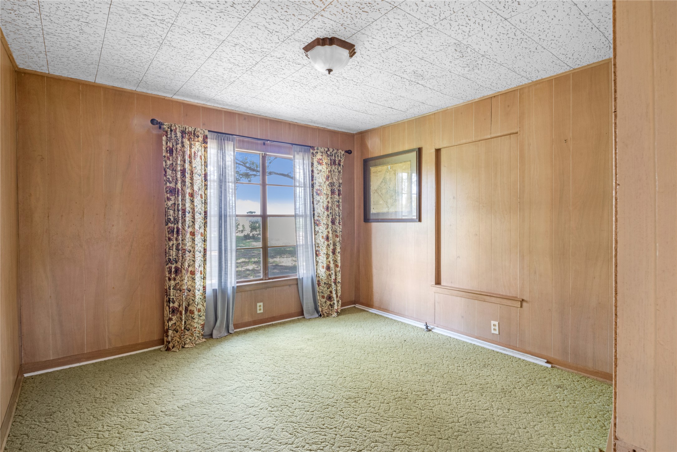 451 Pleasant Grove Road Elgin, TX 78621 - Photo 9 of 32 an empty room with windows