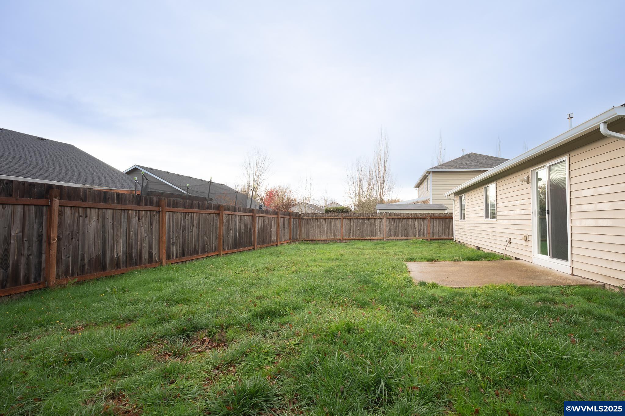 1467 South 7th Street Independence, OR 97351 - Photo 11 of 31 a view of backyard with wooden fence