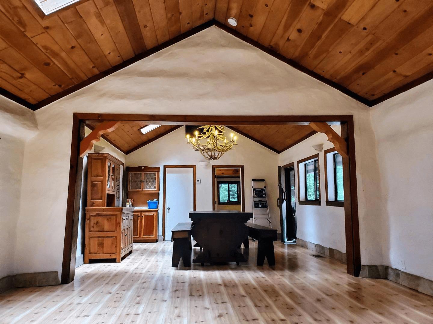 41 Back Road La Honda, CA 94020 - Photo 8 of 101 a view of a living room and hallway with wooden floor