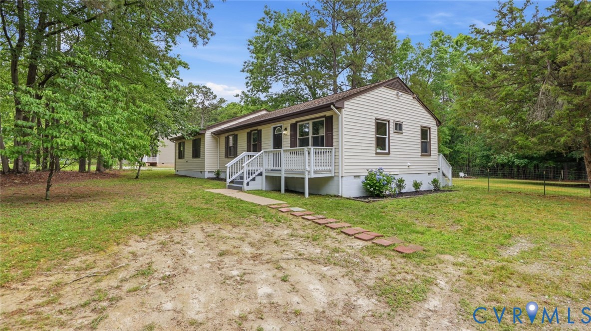 3200 Portugee Road Sandston, VA 23150 - Photo 6 of 26 a view of a house with backyard and garden