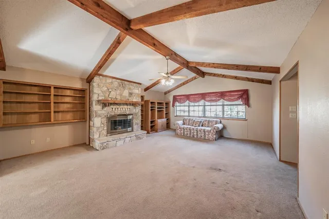 a view of a living room and chandelier or kitchen