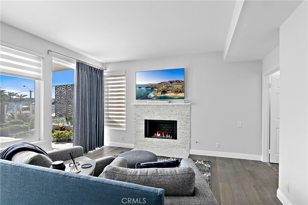75 Palm Beach Court Dana Point, CA 92629 - Photo 16 of 46 a living room with furniture and a fireplace