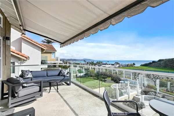 a view of a balcony with furniture