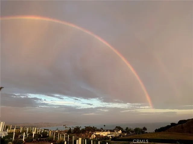 a view of a backyard of a house with a mountain