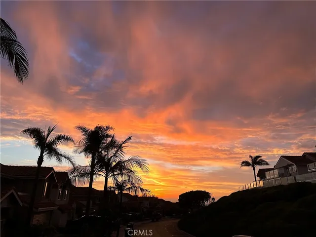 a view of multiple houses with a street