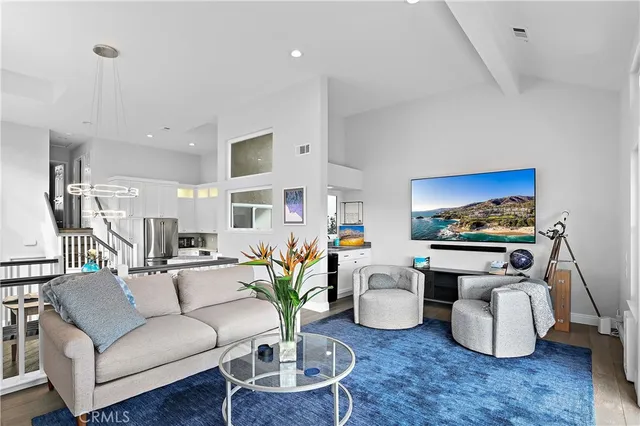 a living room with furniture and a rug