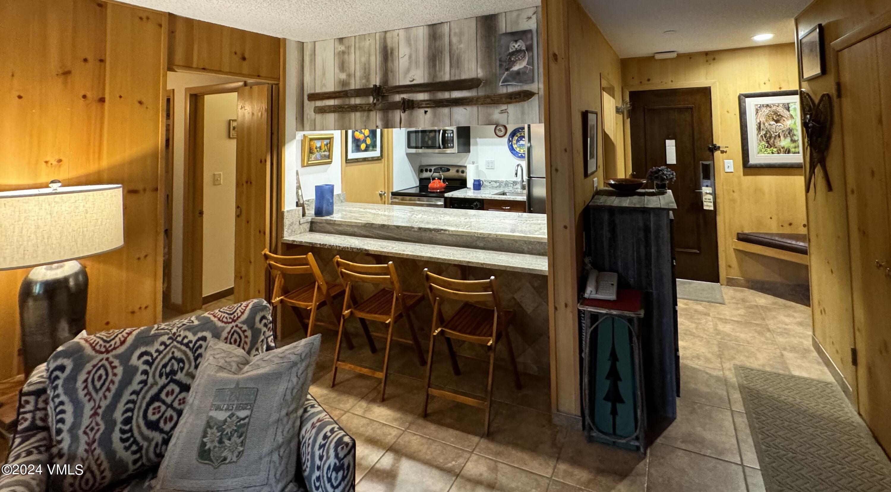 595 Vail Valley Drive, Unit E121 Vail, CO 81657 - Photo 6 of 12 a kitchen with a refrigerator and a sink