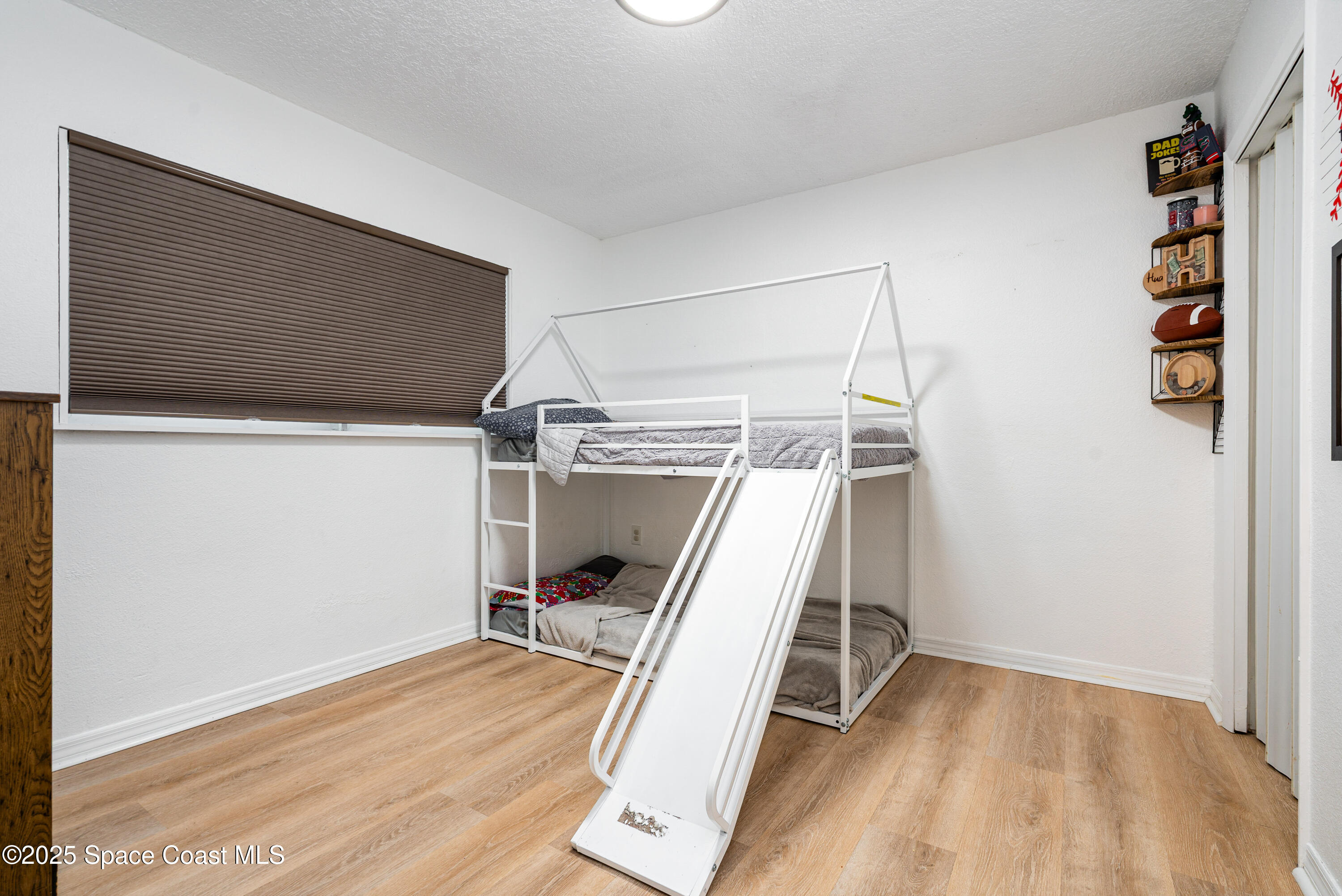 4120 Duke Street Melbourne, FL 32901 - Photo 16 of 29 a view of a room with wooden floor and white walls