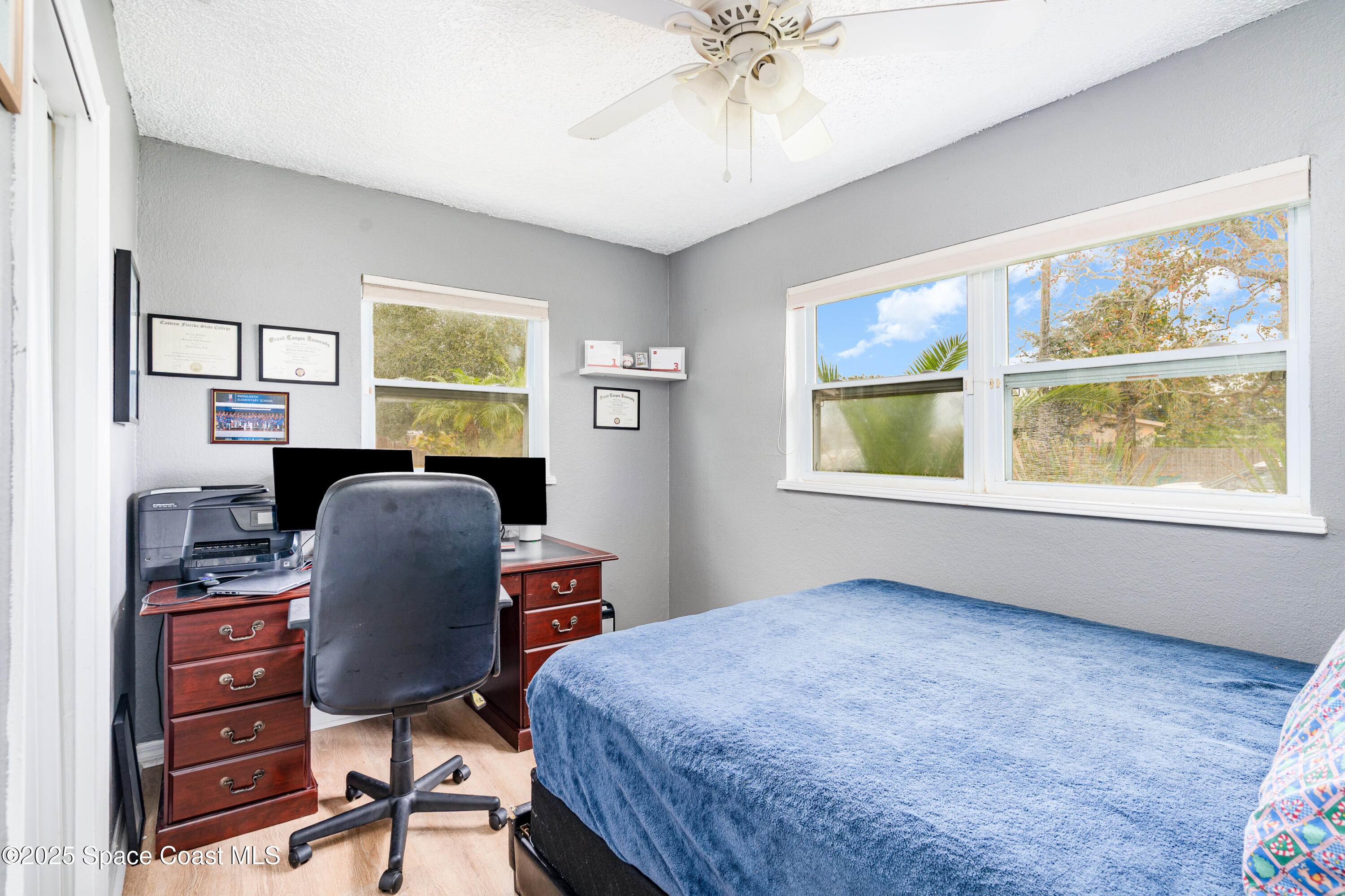 4120 Duke Street Melbourne, FL 32901 - Photo 18 of 29 a workspace with furniture window and wooden floor