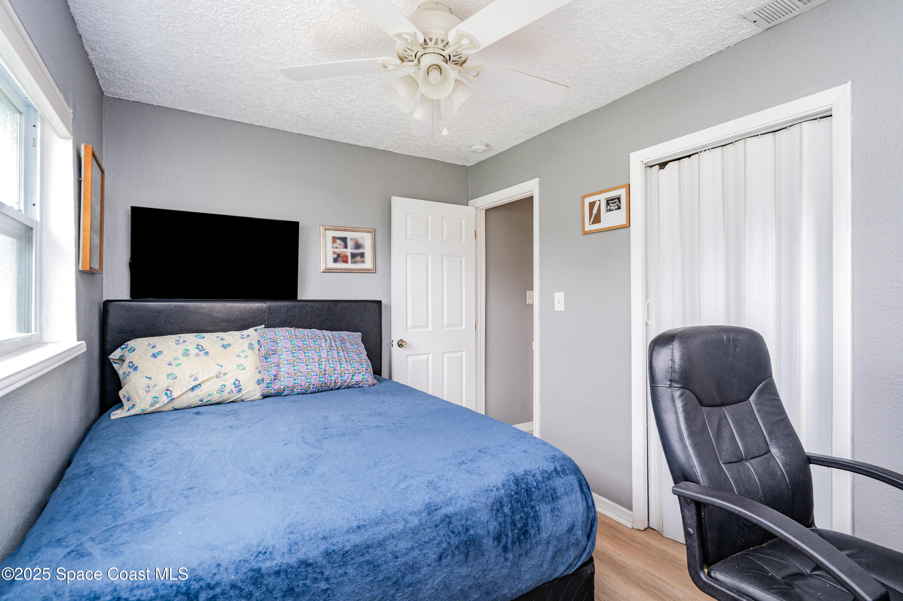 4120 Duke Street Melbourne, FL 32901 - Photo 19 of 29 a bedroom with a bed and furniture