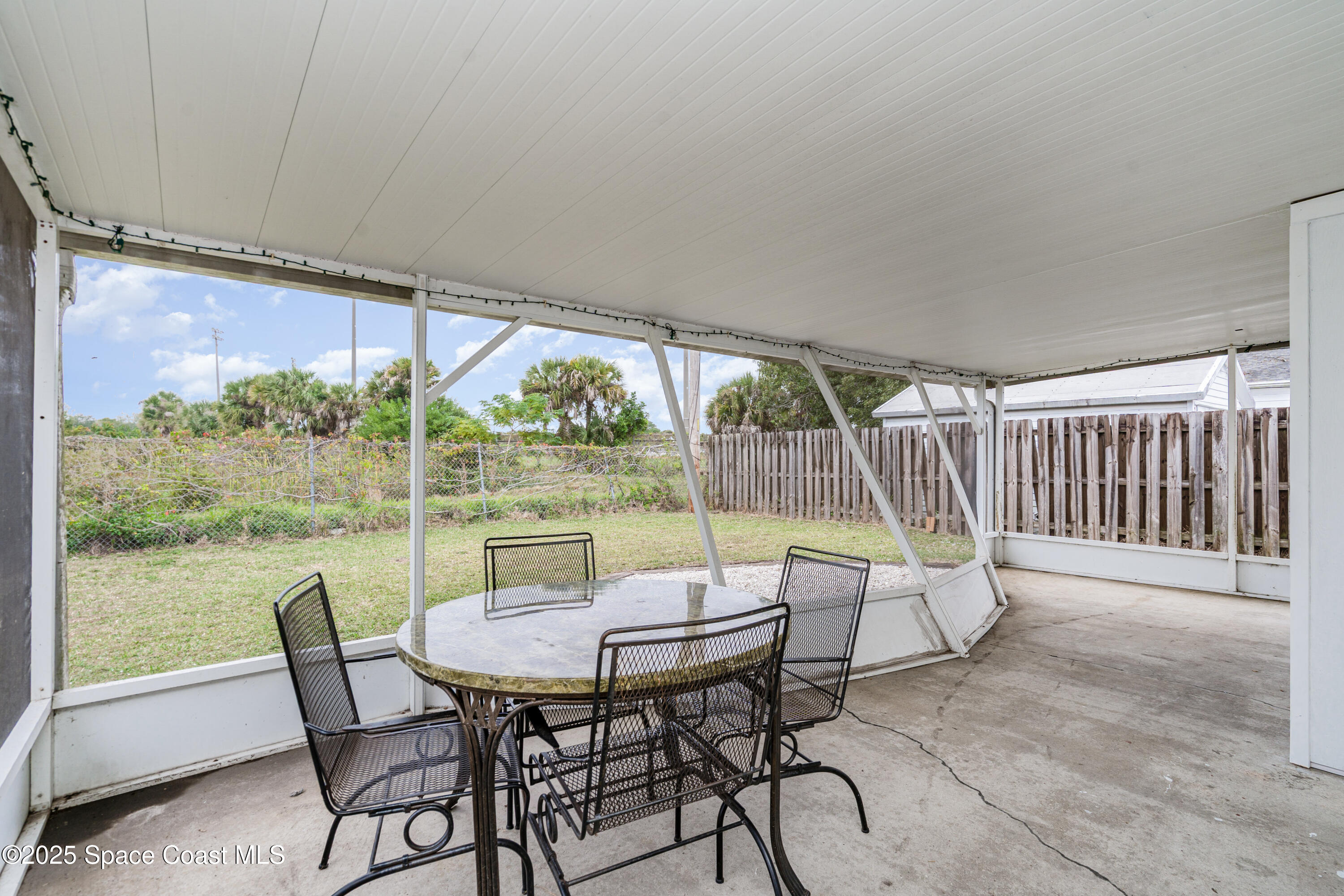4120 Duke Street Melbourne, FL 32901 - Photo 24 of 29 a view of a patio with a table chairs and a backyard