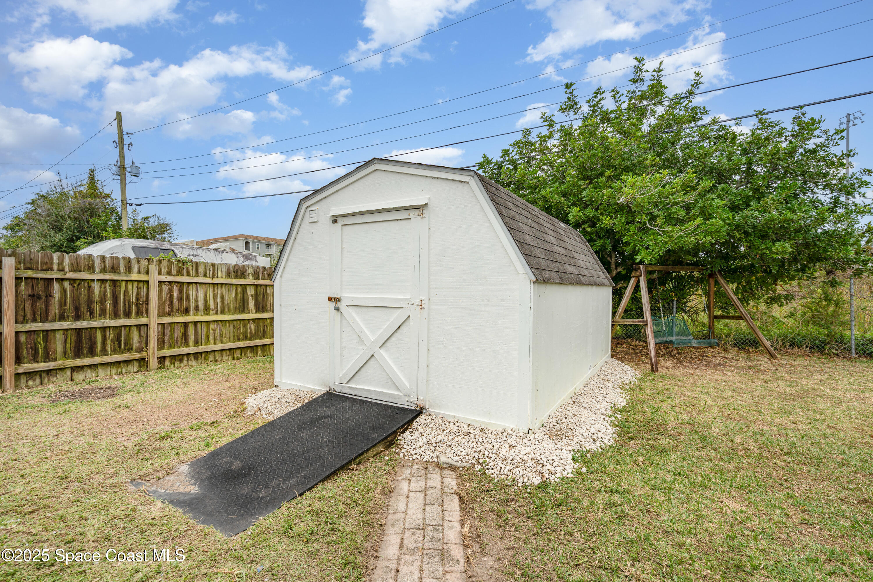 4120 Duke Street Melbourne, FL 32901 - Photo 25 of 29 a front view of a house with a yard