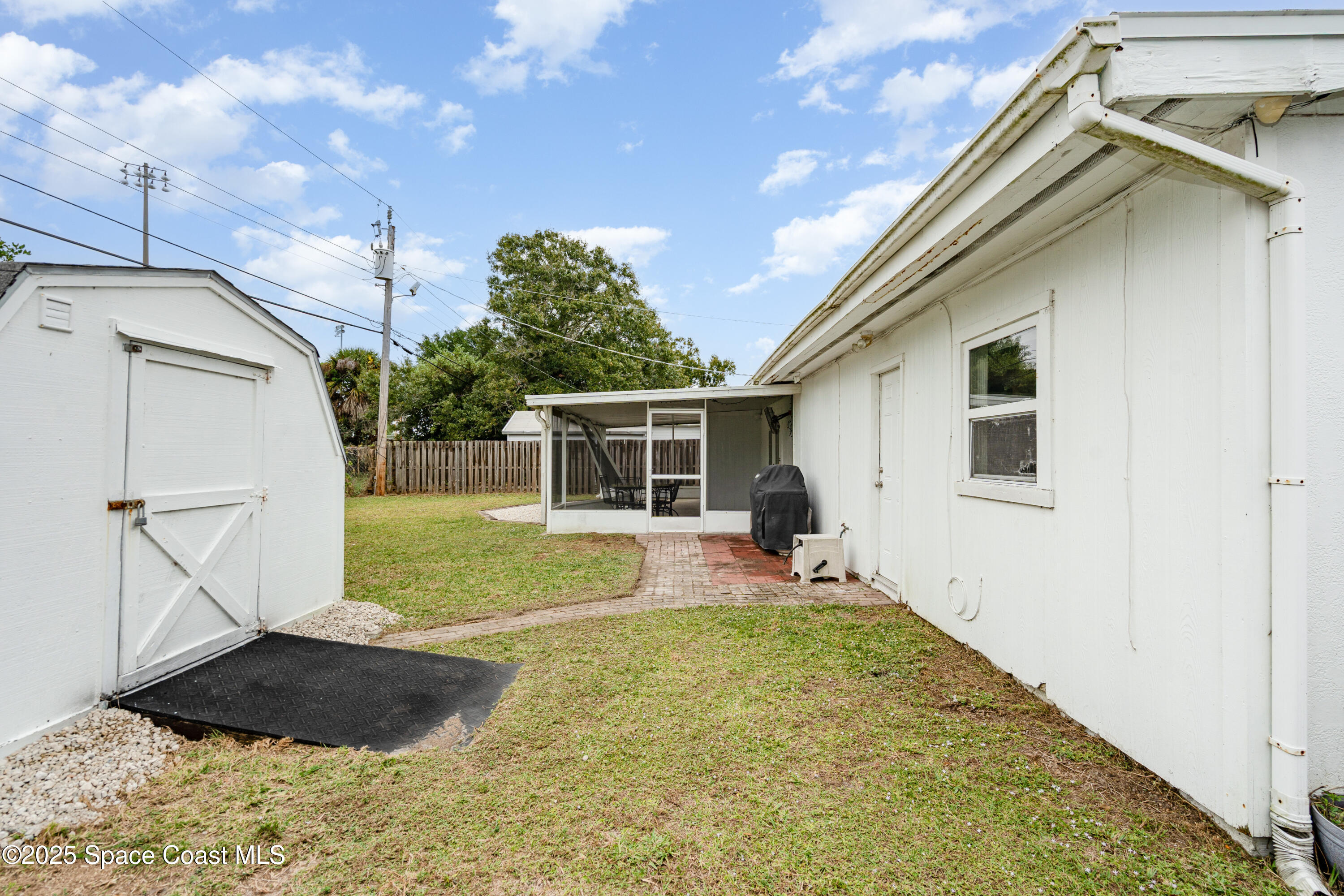 4120 Duke Street Melbourne, FL 32901 - Photo 26 of 29 a front view of house with yard and porch