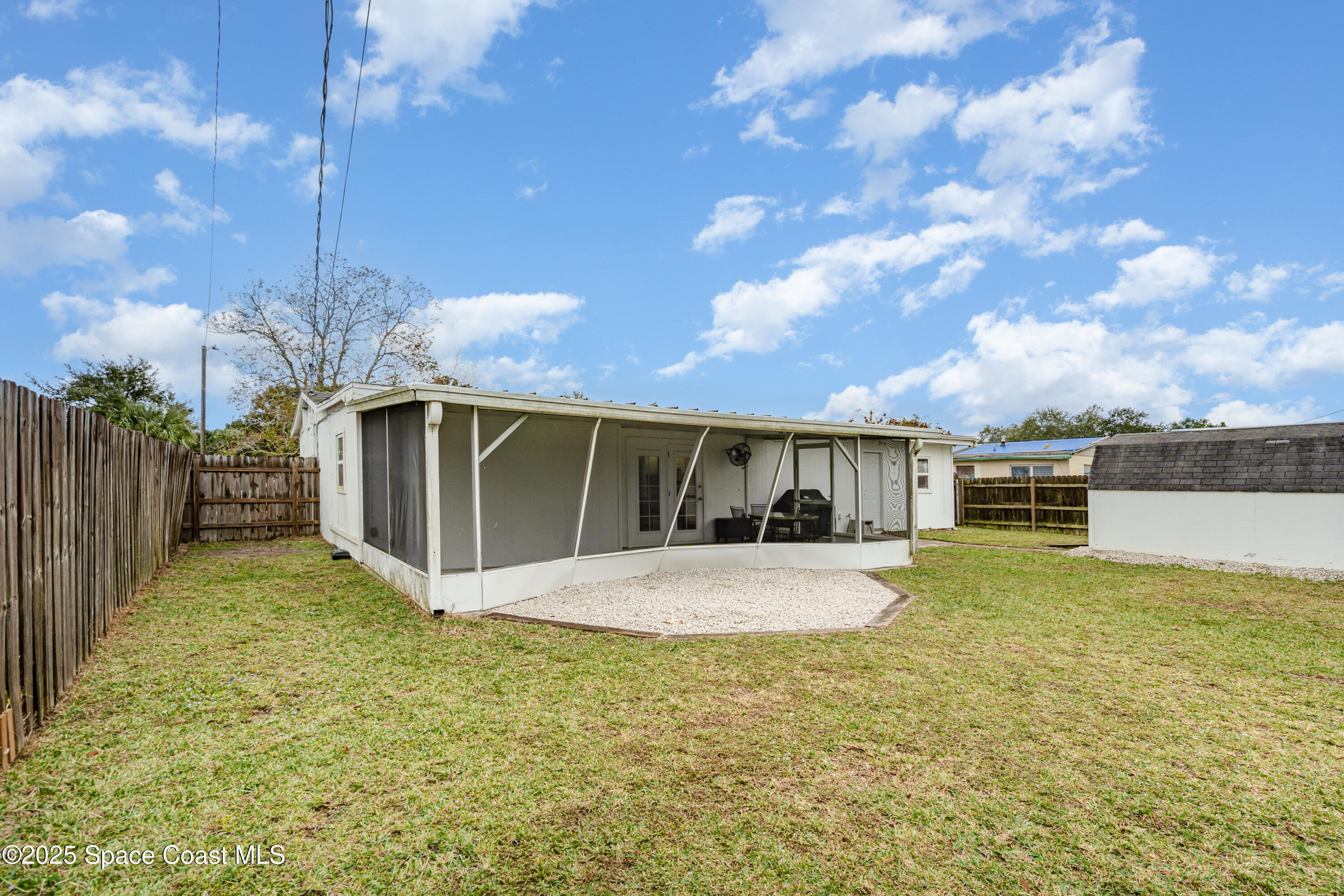 4120 Duke Street Melbourne, FL 32901 - Photo 27 of 29 a front view of a house with a yard and garage
