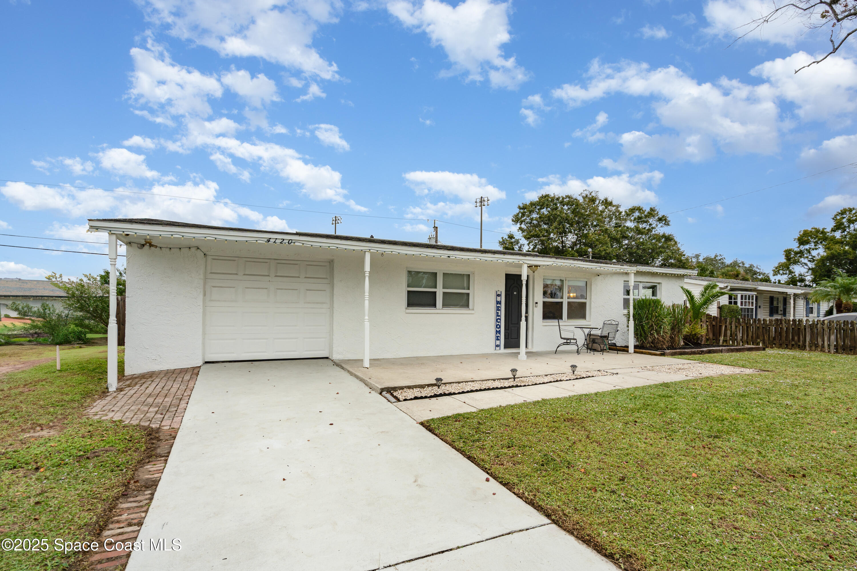 4120 Duke Street Melbourne, FL 32901 - Photo 4 of 29 a front view of a house with garden