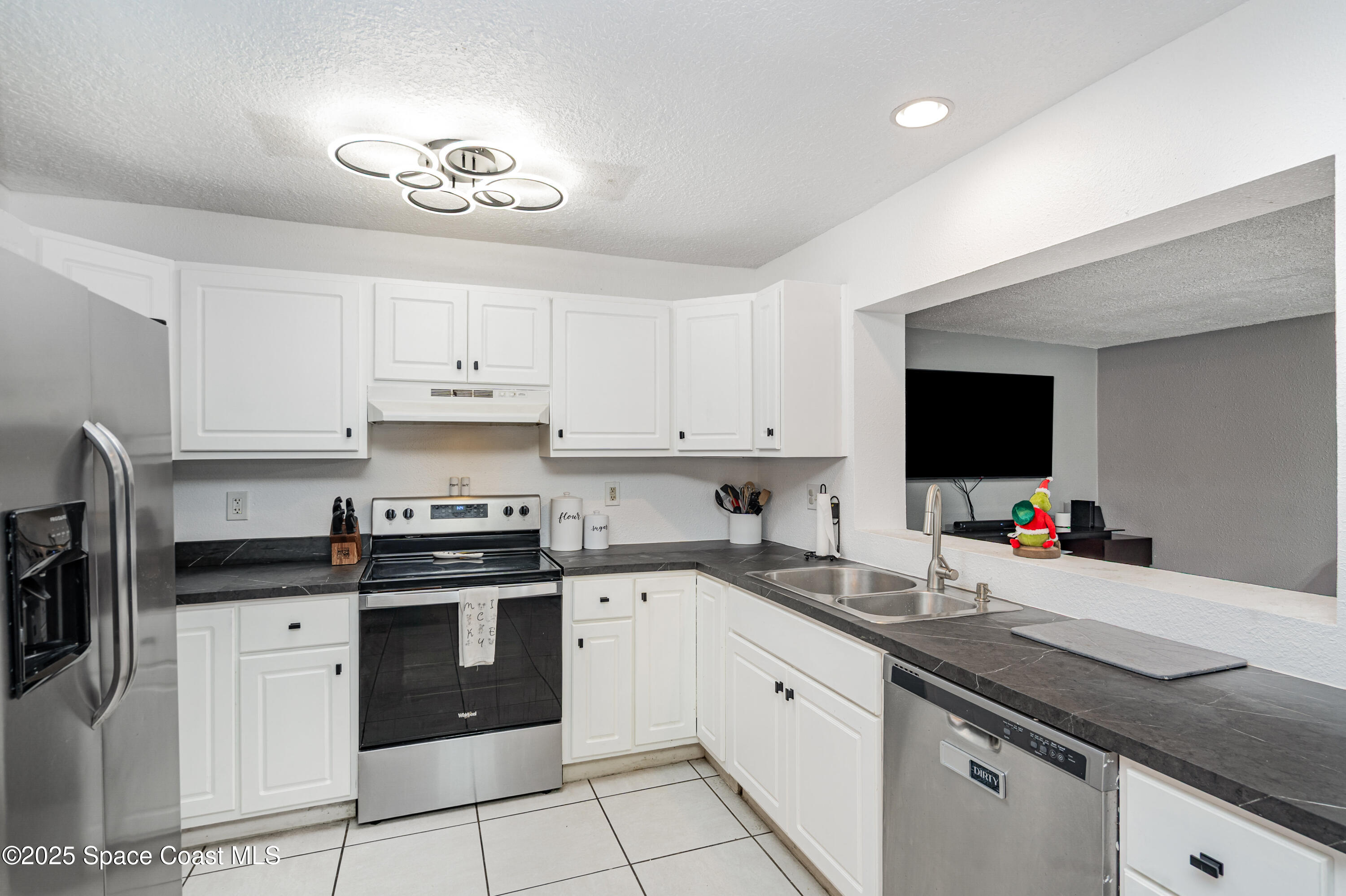 4120 Duke Street Melbourne, FL 32901 - Photo 7 of 29 a kitchen with a sink cabinets and stainless steel appliances