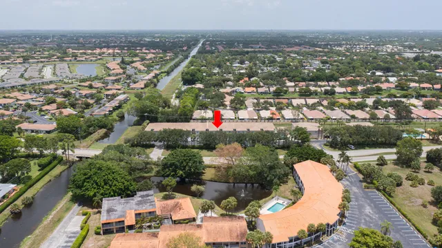 an aerial view of residential building and lake