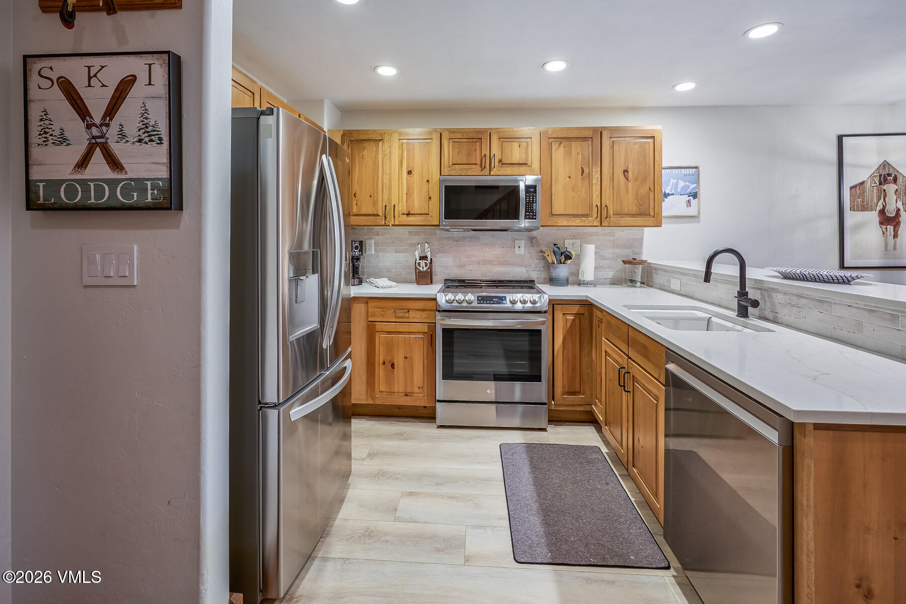 30 Cresta Road, Unit 306 Edwards, CO 81632 - Photo 11 of 26 a kitchen with stainless steel appliances granite countertop a stove top oven a sink and dishwasher