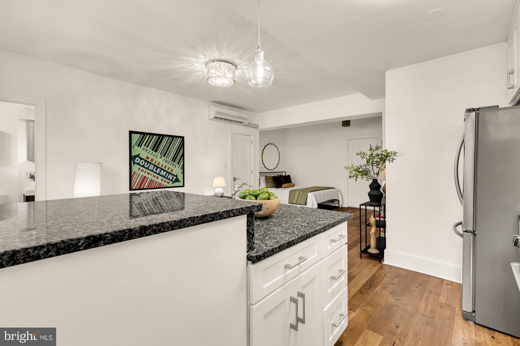 1910 Kalorama Road Northwest, Unit 302 Washington, DC 20009 - Photo 13 of 28 a kitchen with granite countertop a sink and a refrigerator
