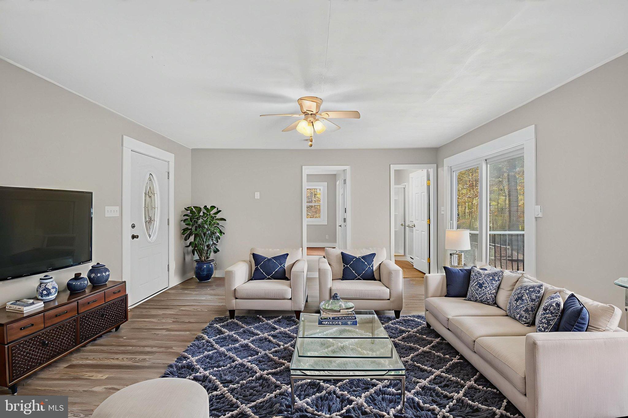 19239 Mountain Track Road Orange, VA 22960 - Photo 11 of 19 a living room with furniture and a flat screen tv