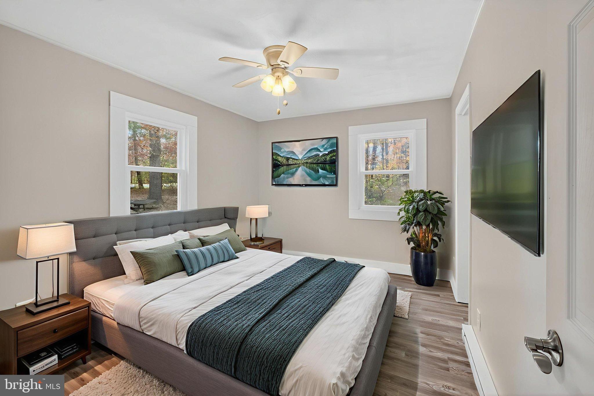 19239 Mountain Track Road Orange, VA 22960 - Photo 13 of 19 a bedroom with bed and a chandelier