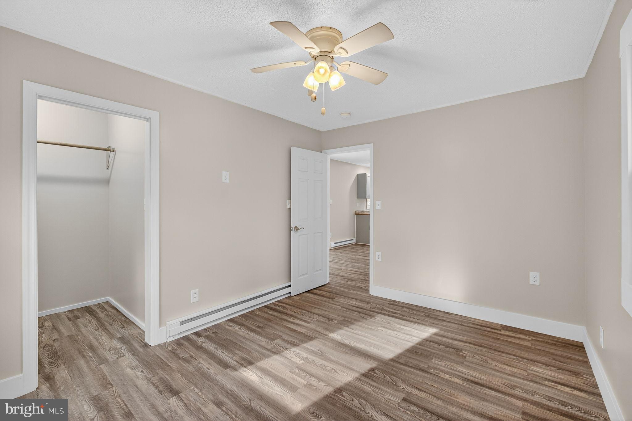 19239 Mountain Track Road Orange, VA 22960 - Photo 14 of 19 a view of an empty room and chandelier fan