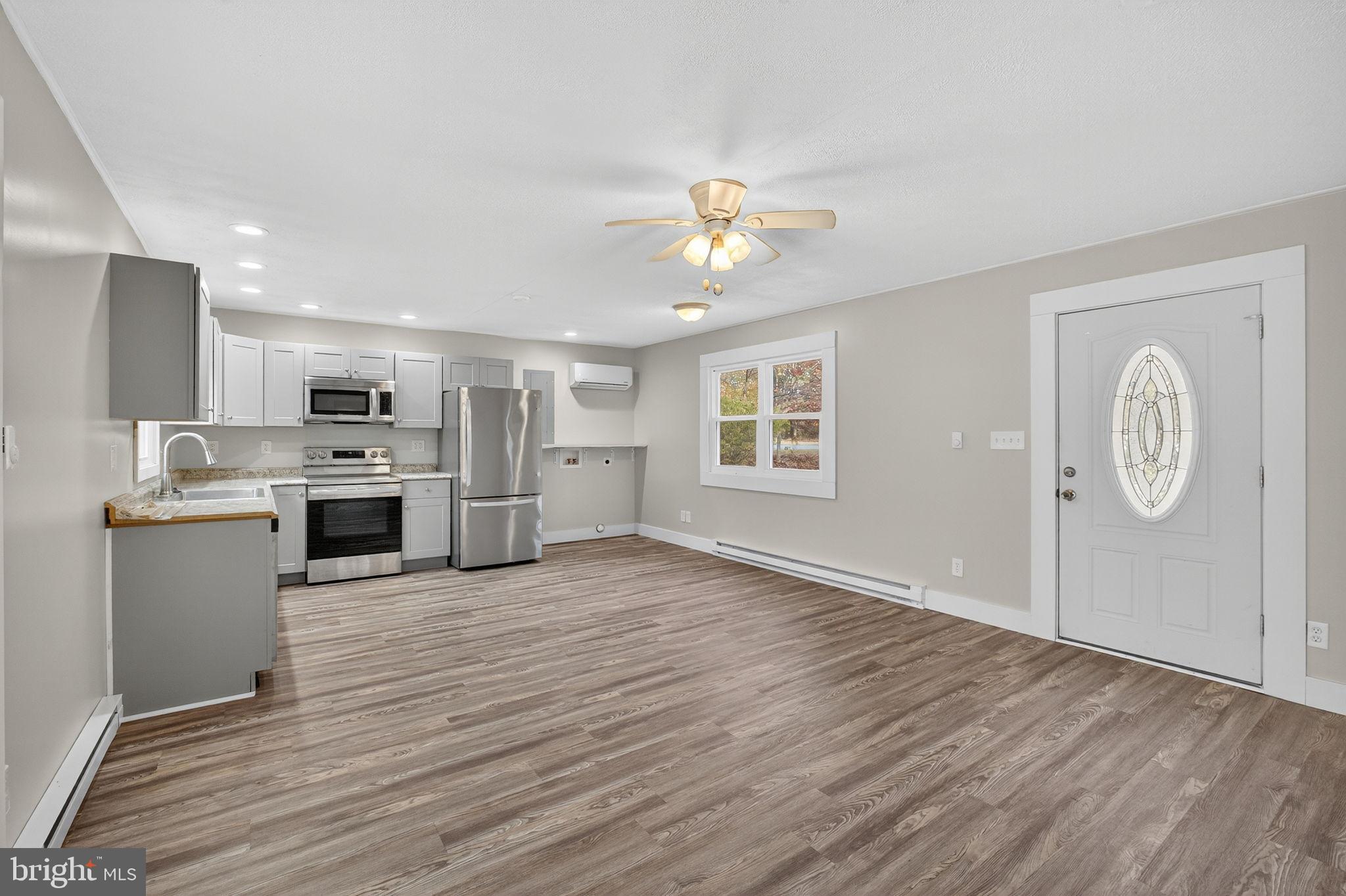 19239 Mountain Track Road Orange, VA 22960 - Photo 6 of 19 a view of kitchen with granite countertop cabinets stainless steel appliances with wooden floor
