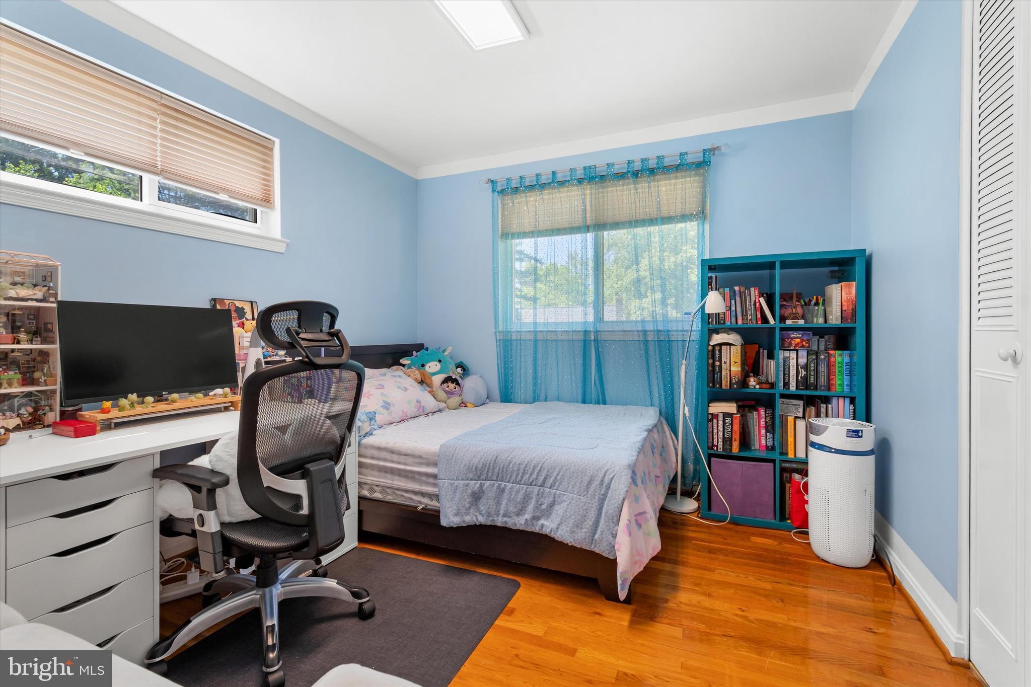 8304 Harland Drive Springfield, VA 22152 - Photo 22 of 39 a bedroom with bed and a bookshelf