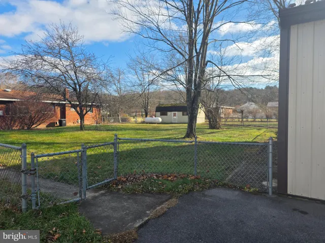 a view of a park with swings and slides