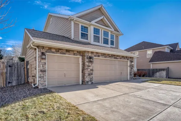 a front view of a house with a garage