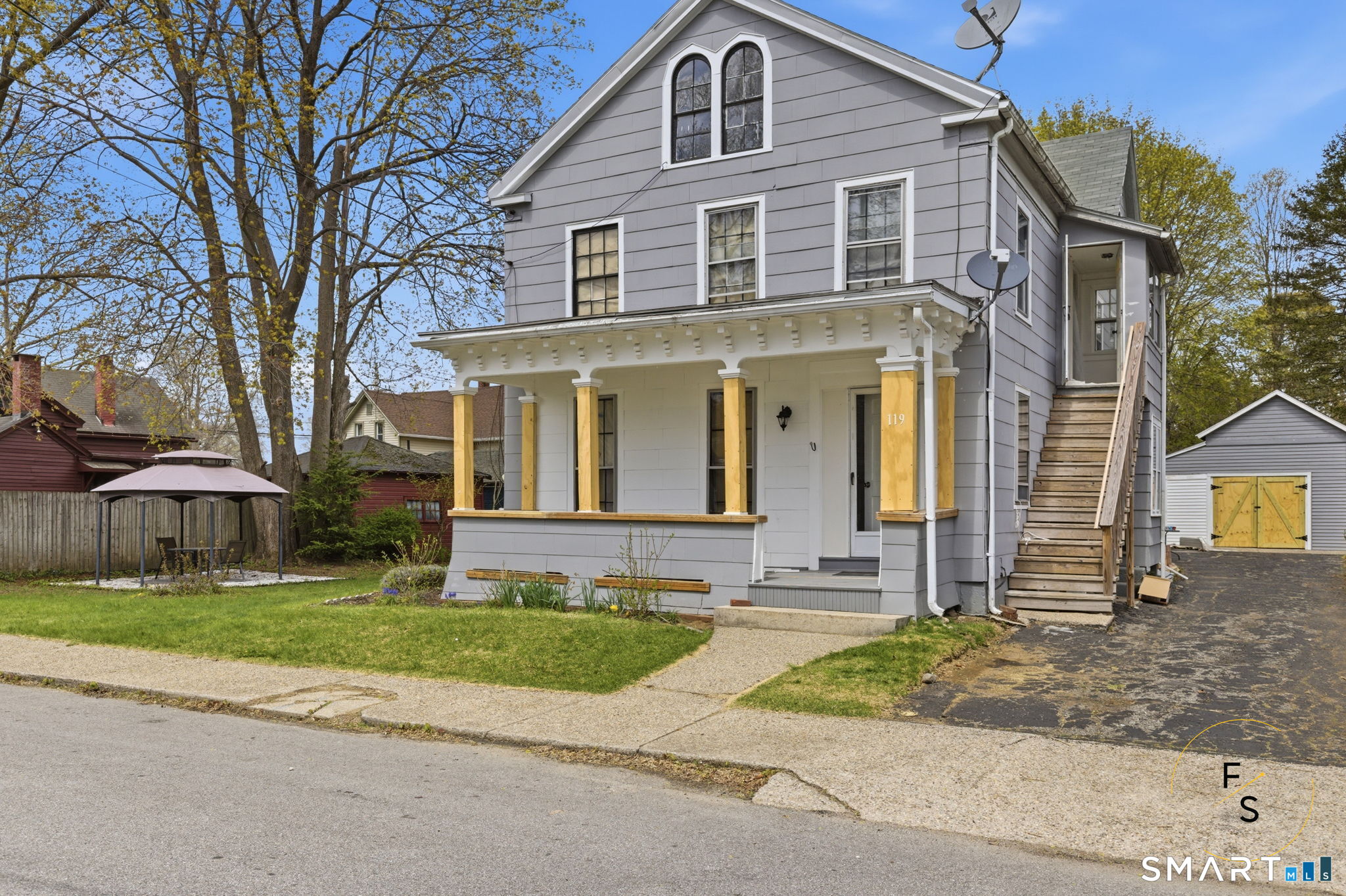 119 Williams Street Norwich, CT 06360 - Photo 2 of 40 a front view of a house with a yard