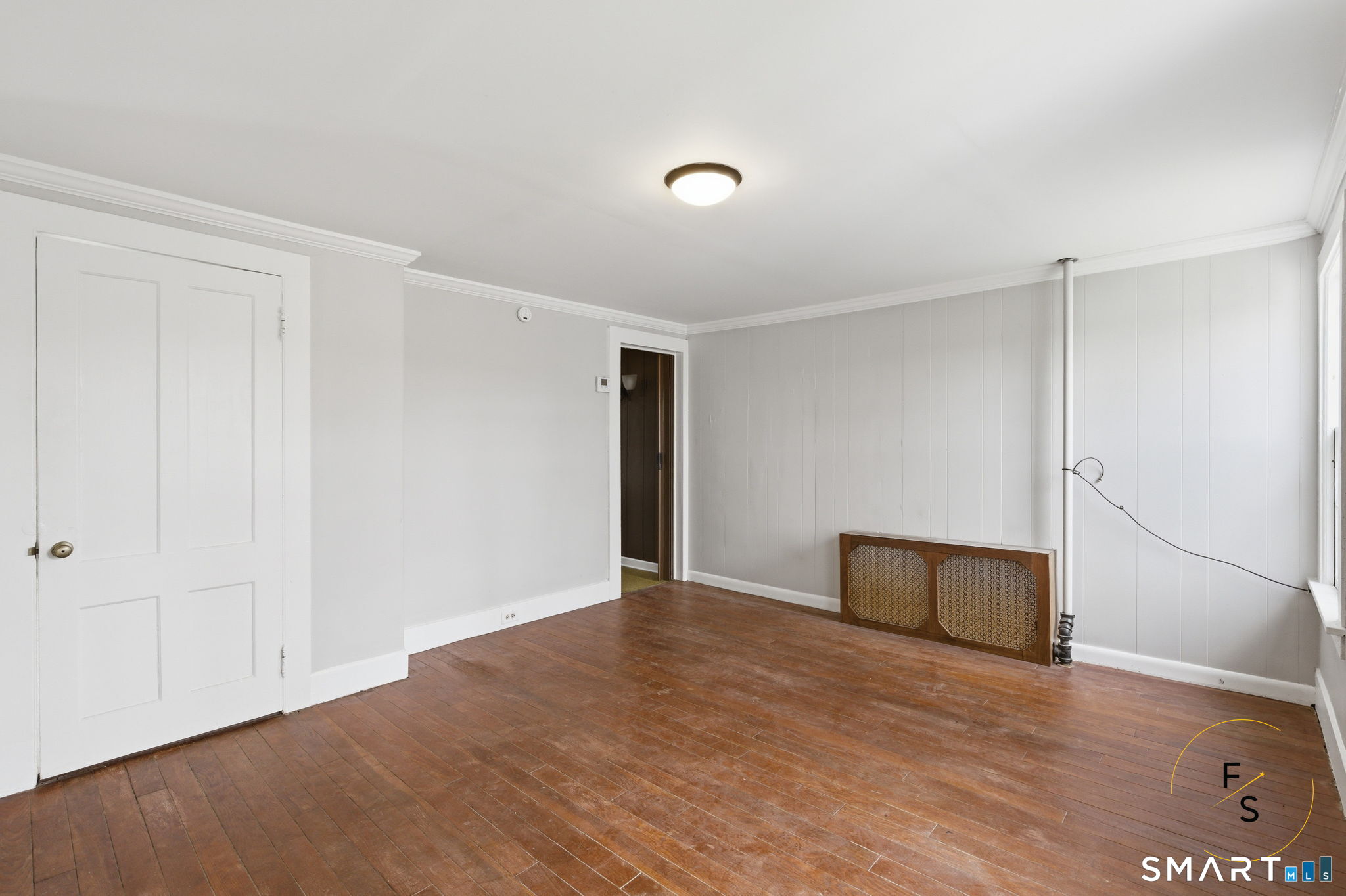 119 Williams Street Norwich, CT 06360 - Photo 21 of 40 a view of empty room with wooden floor
