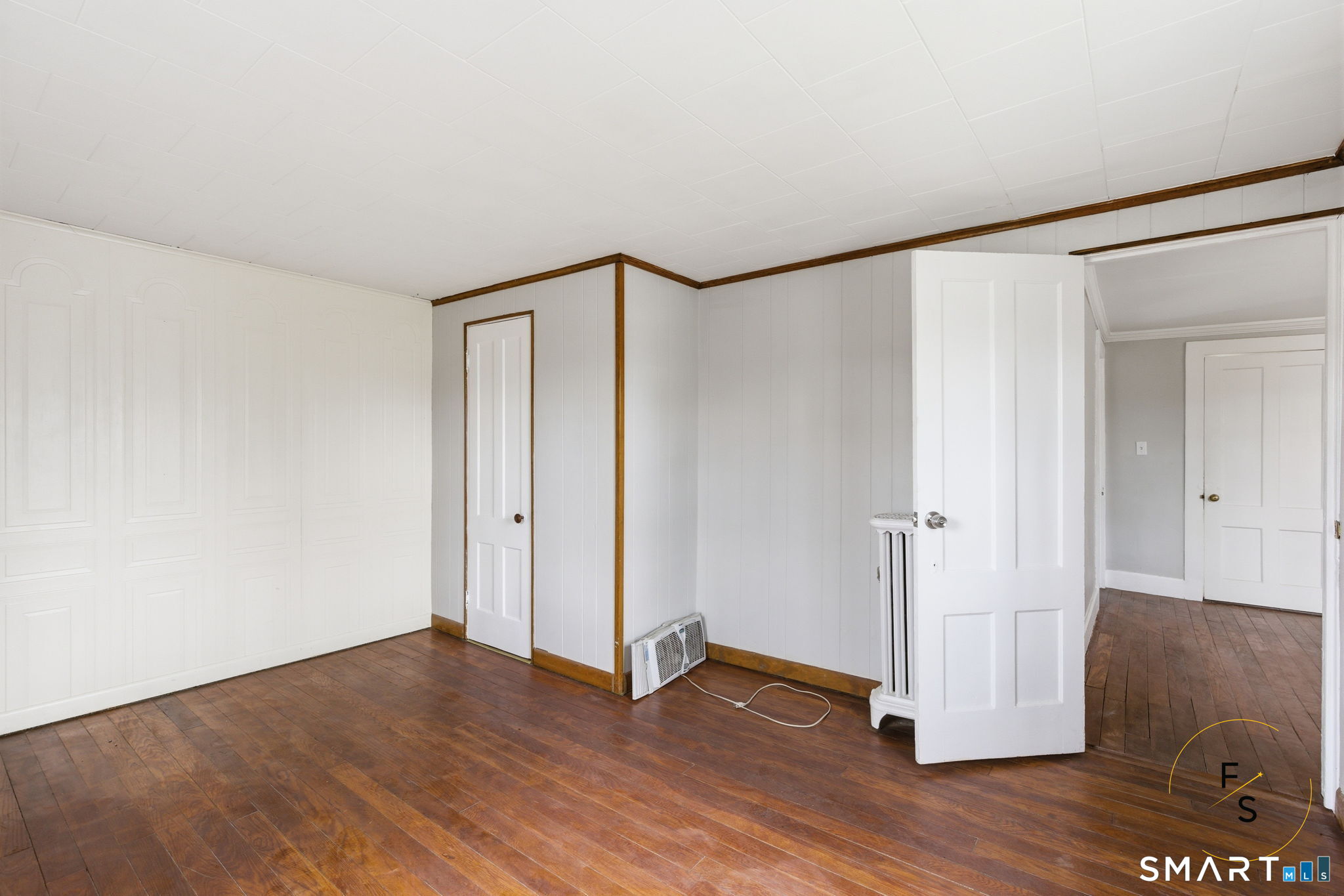 119 Williams Street Norwich, CT 06360 - Photo 27 of 40 a view of an empty room with wooden floor and closet