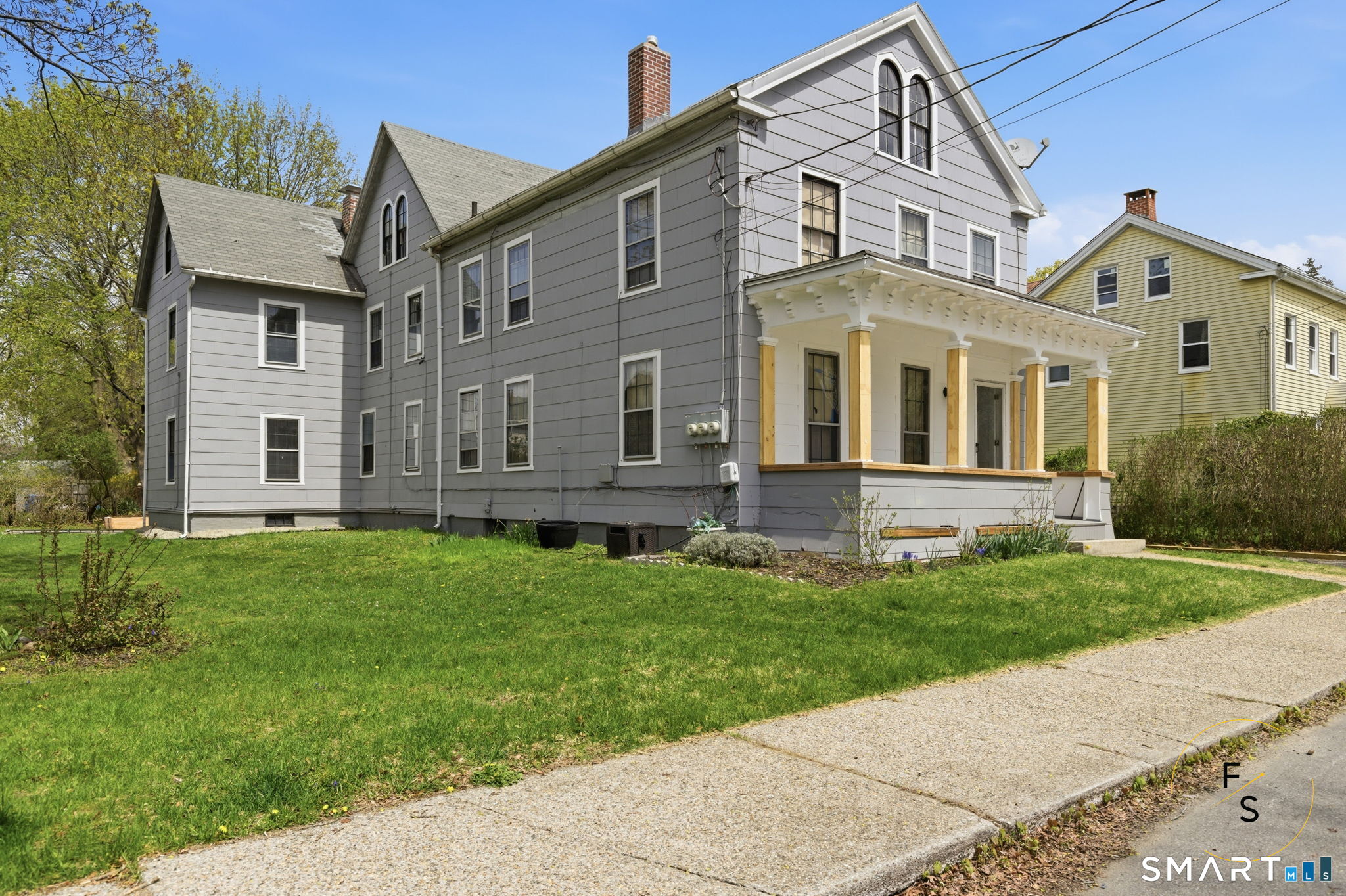 119 Williams Street Norwich, CT 06360 - Photo 3 of 40 front view of a house with a yard