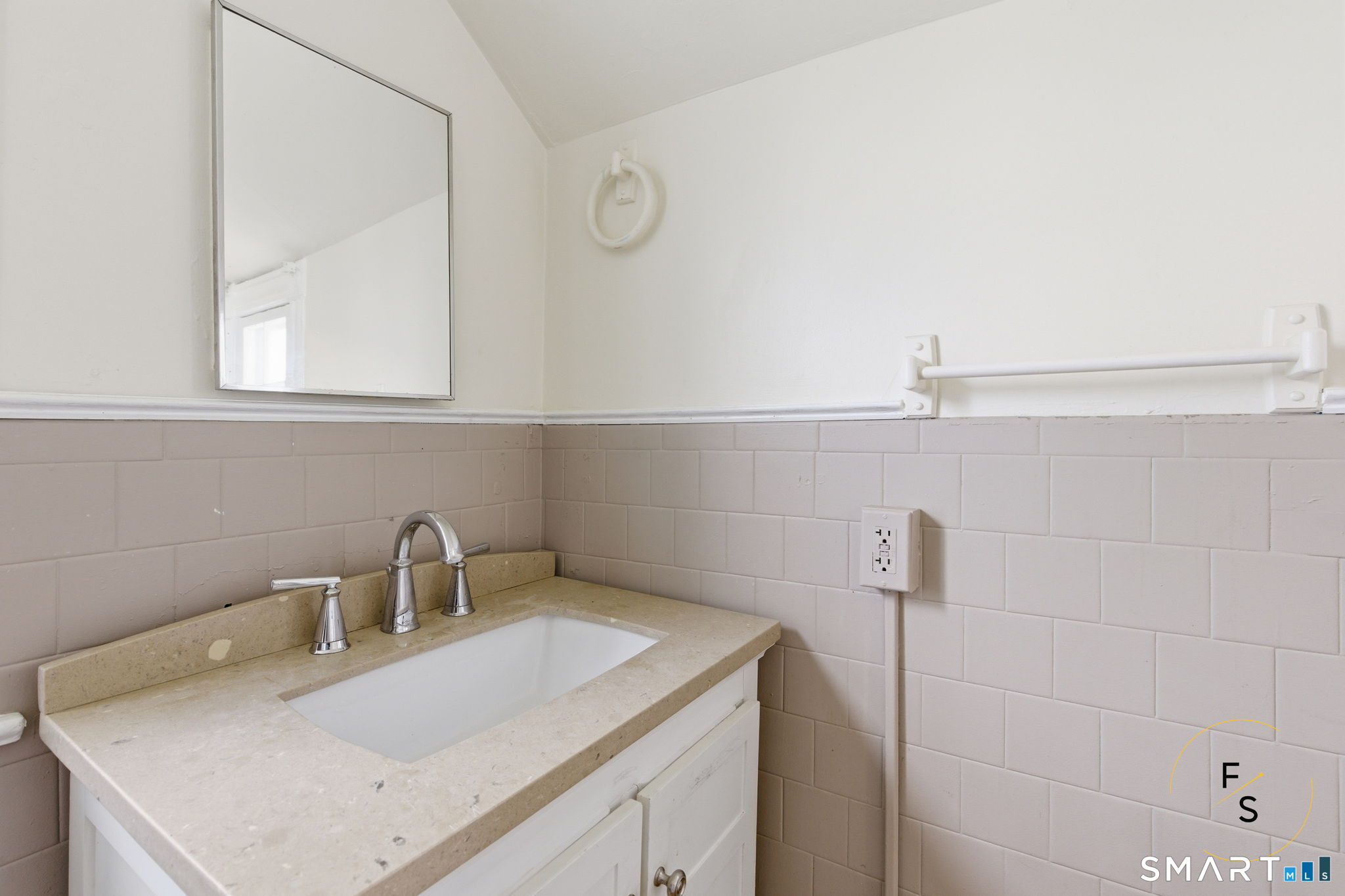 119 Williams Street Norwich, CT 06360 - Photo 6 of 40 a bathroom with a sink and cabinets