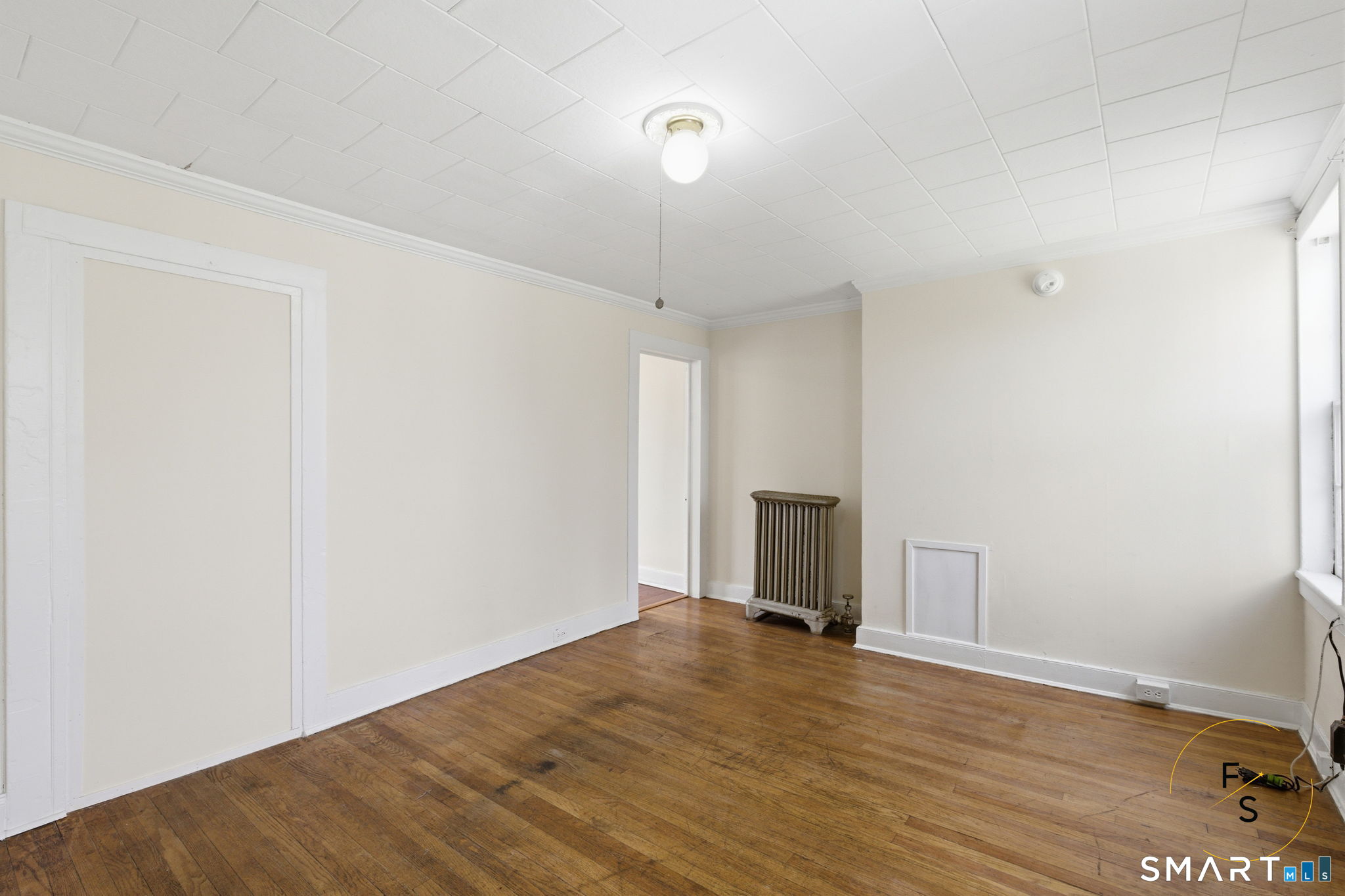 119 Williams Street Norwich, CT 06360 - Photo 9 of 40 a view of empty room with wooden floor