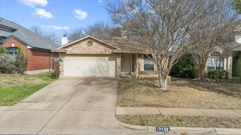 a view of a house with a yard and garage