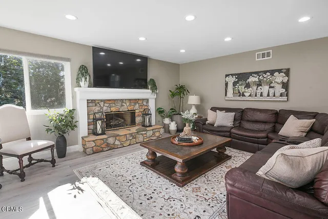 a living room with furniture and a table