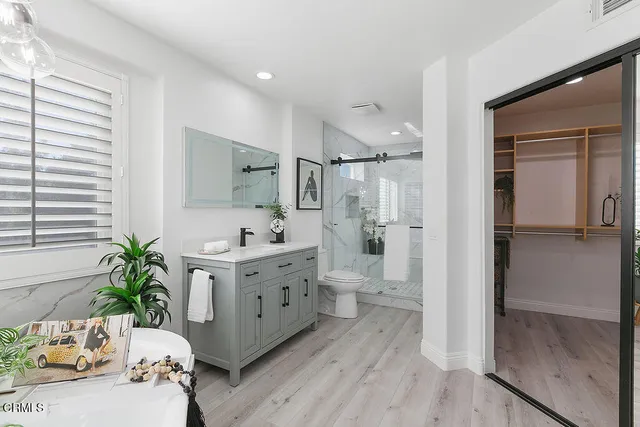 a front view of a house with swimming pool having outdoor seating