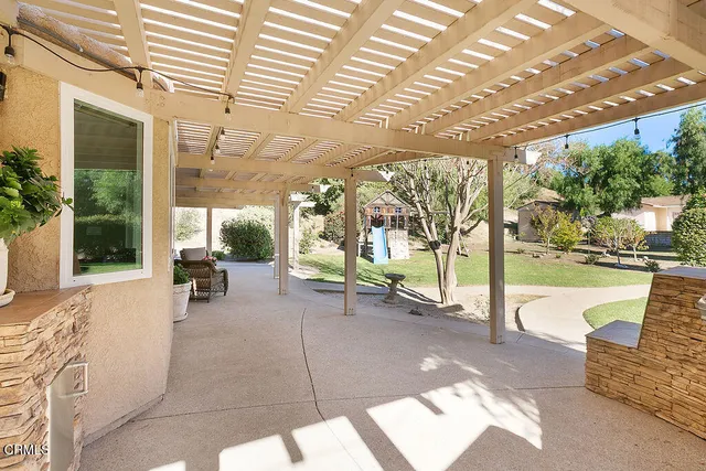 a front view of a house with garden and porch