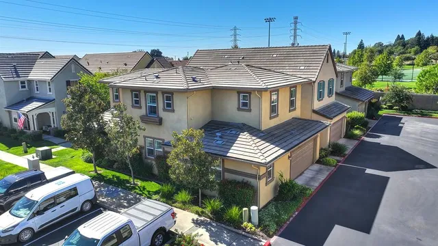 an aerial view of a house with a yard