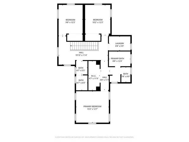 a picture of a bench in front of a white house