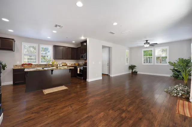 a view of kitchen with cabinets and wooden floor