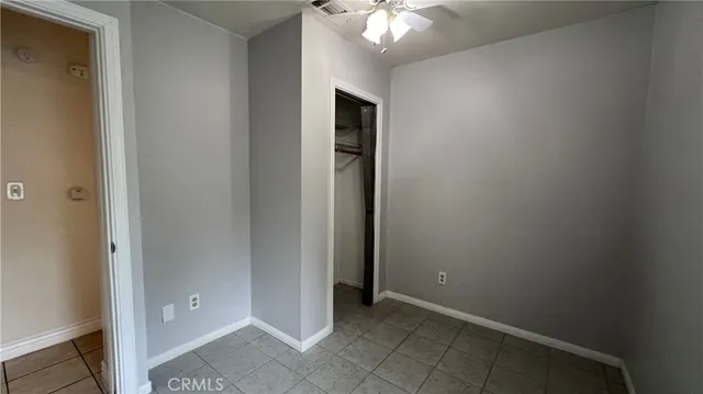 an empty room with closet area