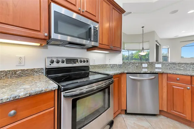 a view of a room with window and chandelier