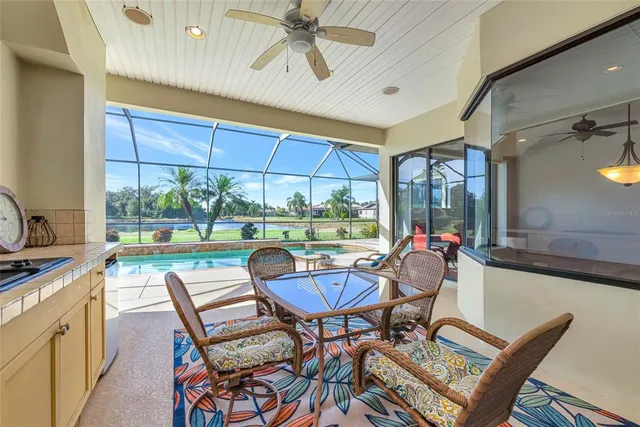 a view of a city with lots of residential buildings ocean and mountain view in back